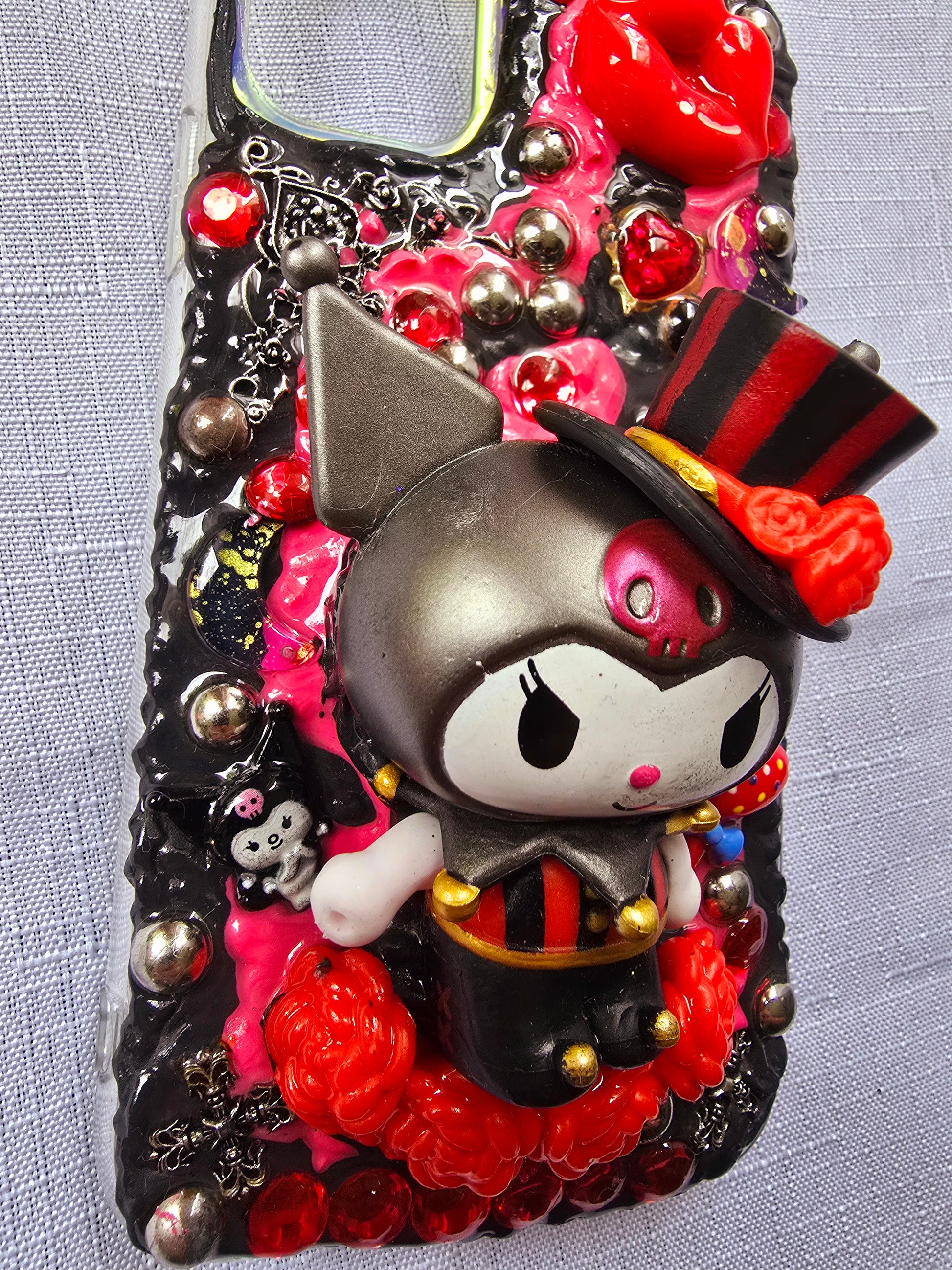 Handmade iPhone 11 phone case inspired by Kuromi in red and black colors – cute, edgy, and perfect for Sanrio fans.