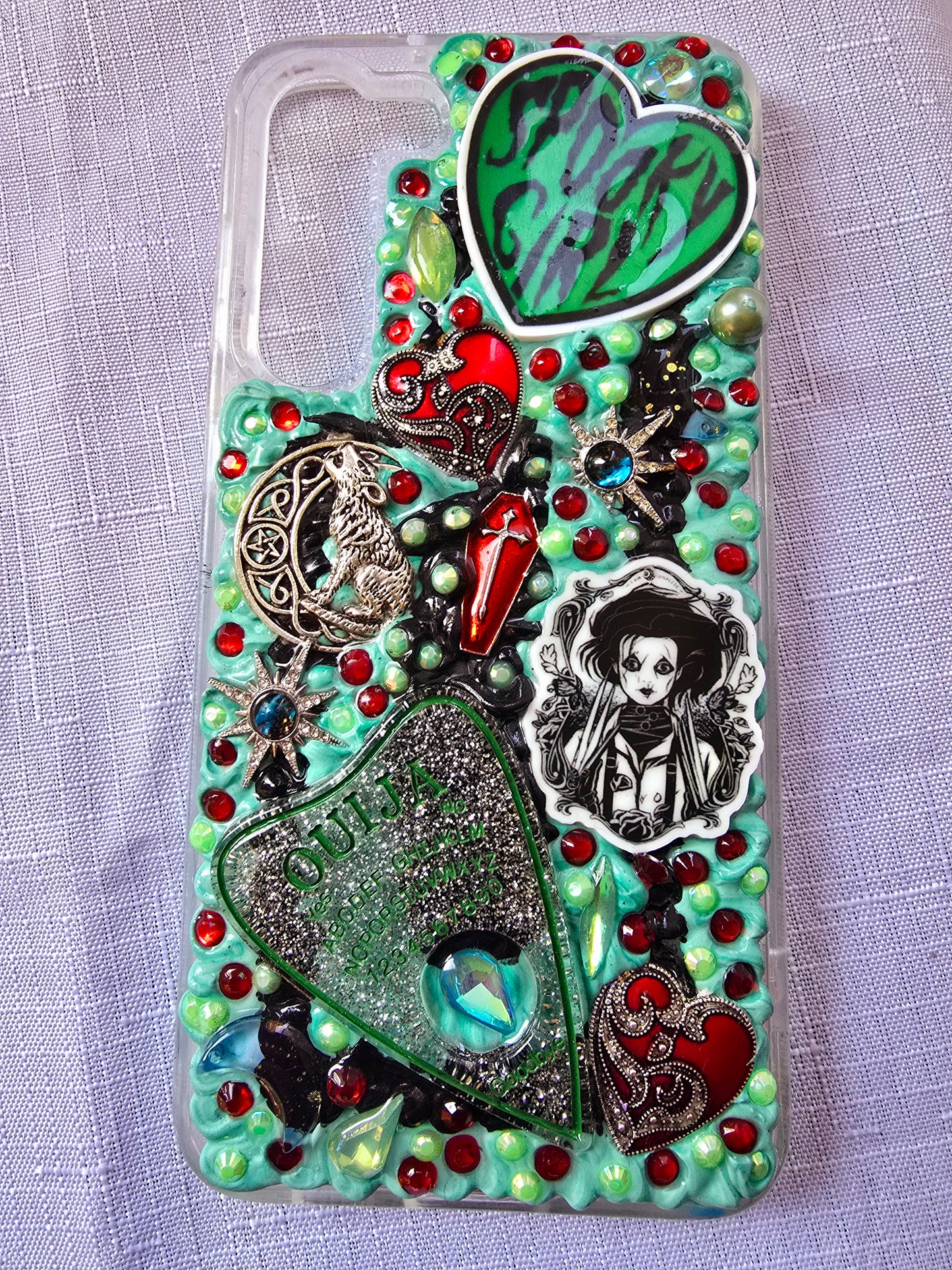Handmade horror and witchy-themed Samsung S23 Plus phone case in green, red, and black