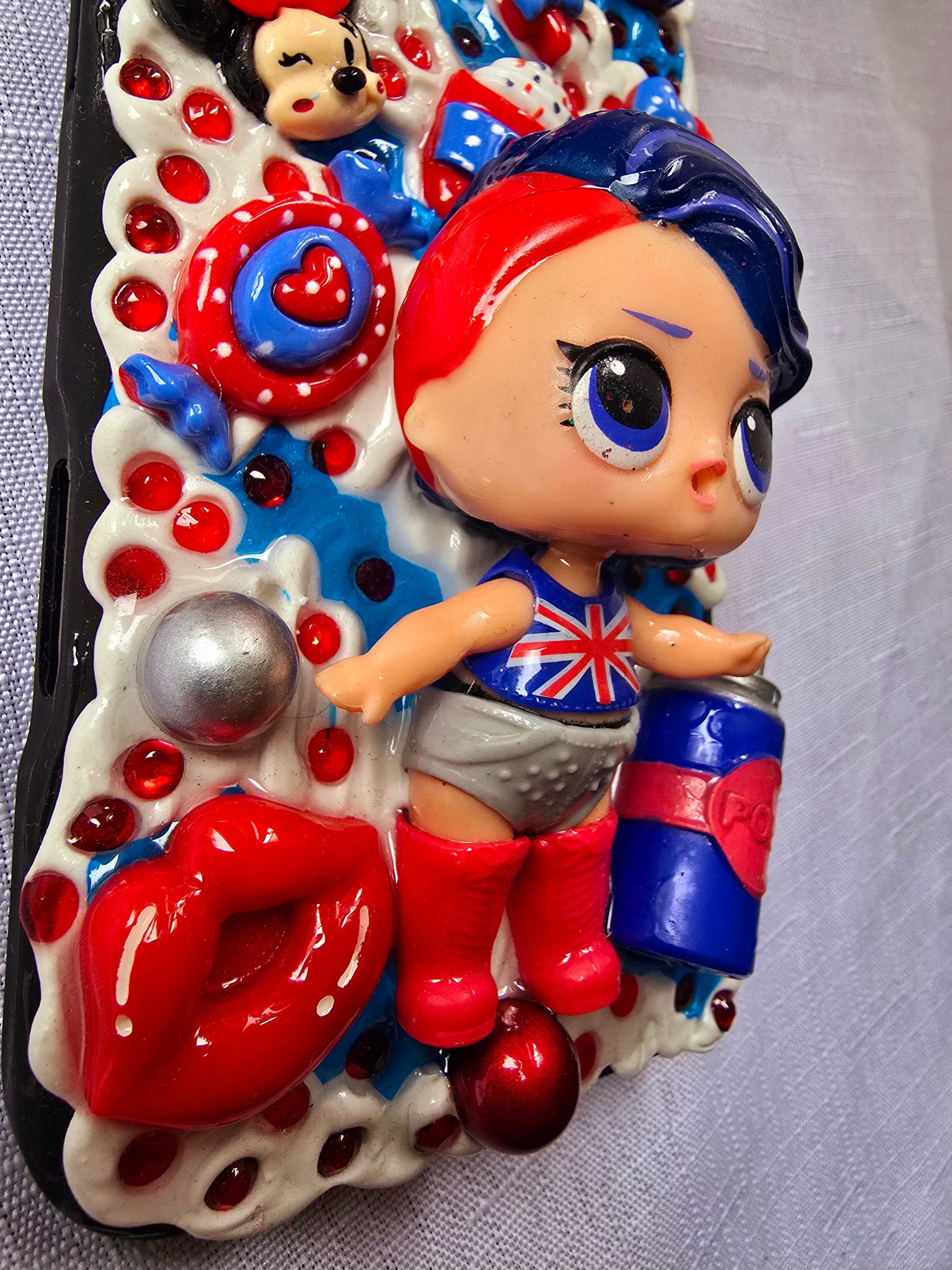 A handmade red and blue iPhone 16 plus phone case