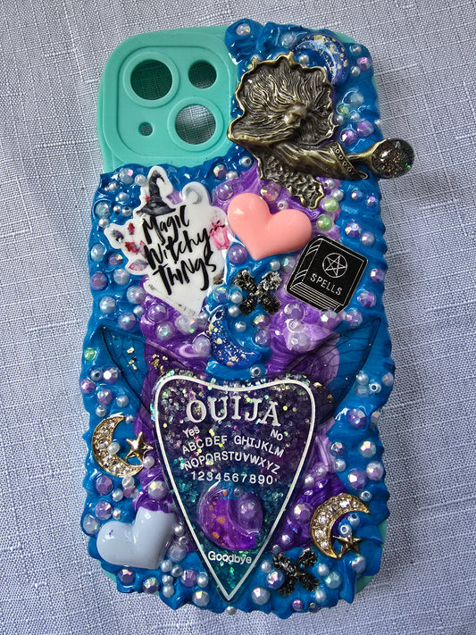 Handmade iPhone 13 phone case in blue and purple with a spiritual and witchy aesthetic, featuring mystical and magical-themed decorations