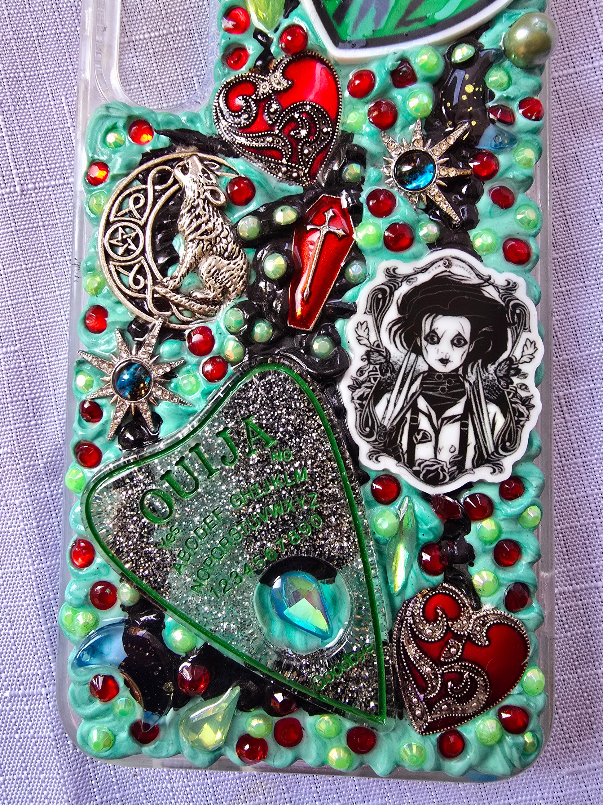 Handmade horror and witchy-themed Samsung S23 Plus phone case in green, red, and black
