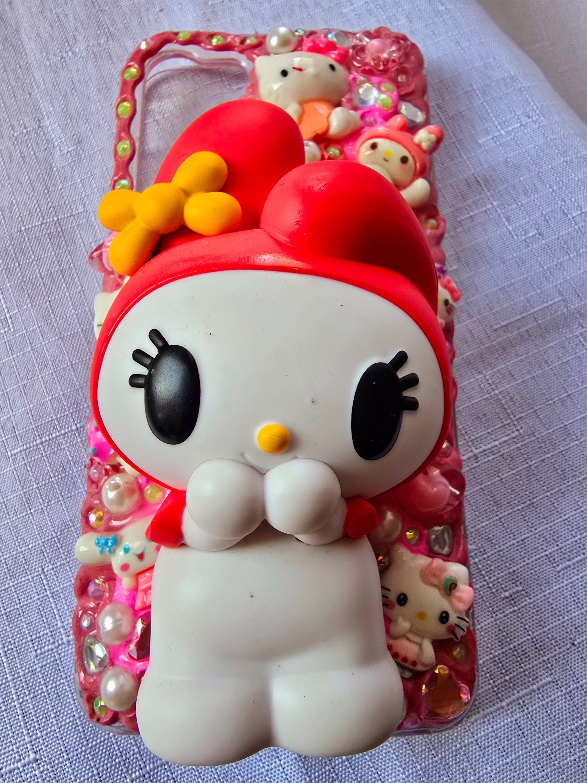 Handmade Samsung S23 Plus phone case featuring a My Melody theme in pink, white, and yellow with cute 3D decorations and kawaii charm accents.